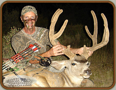 Joe with his trophy Pope & Young Muley Buck taken while bowhunting at our Trophy Mule Deer Hunting Camp #4 in SW Colorado