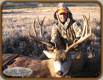 Hunter with his dandy trophy Colorado Mule Deer taken at our Hunting Camp #6