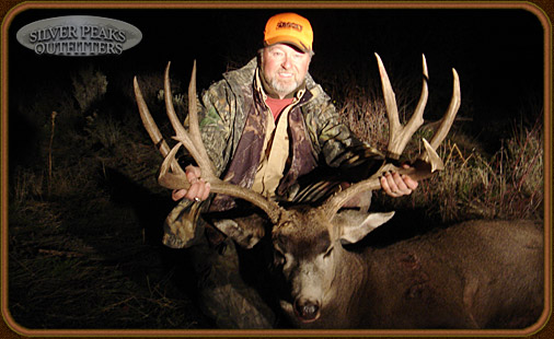 Bill shows off his Trophy Boone & Crocket Mule Deer Buck taken at Colorado Hunting Camp #4 with Silver Peaks Outfitters in the San Juan National Forest Bill shows off his Trophy Boone & Crocket Mule Deer Buck taken at Colorado Hunting Camp #4 with Silver Peaks Outfitters in the San Juan National Forest