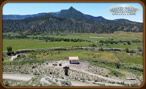 The cabin under construction overlooking some of the irrigated hay fields that attract a variety of Mule Deer & Elk